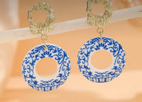 Elegant gold and porcelain blue and white dangle earrings